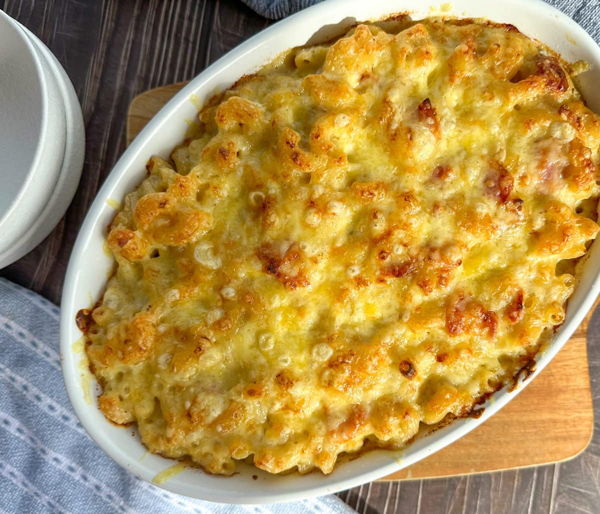 Baked Macaroni Cheese in white serving dish