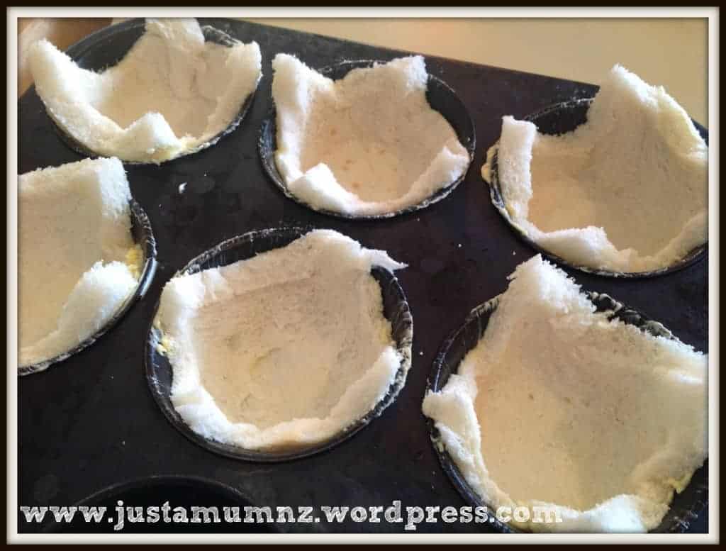 Putting the bread in the muffin tray