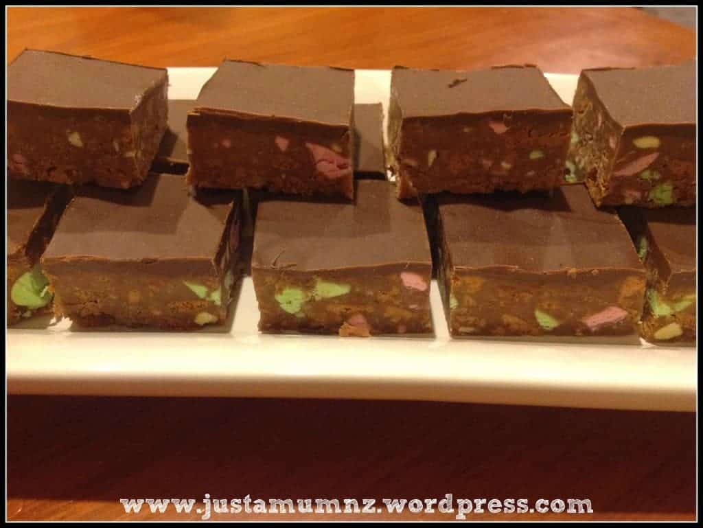 Chocolate Clinker Slice stacked on a white platter