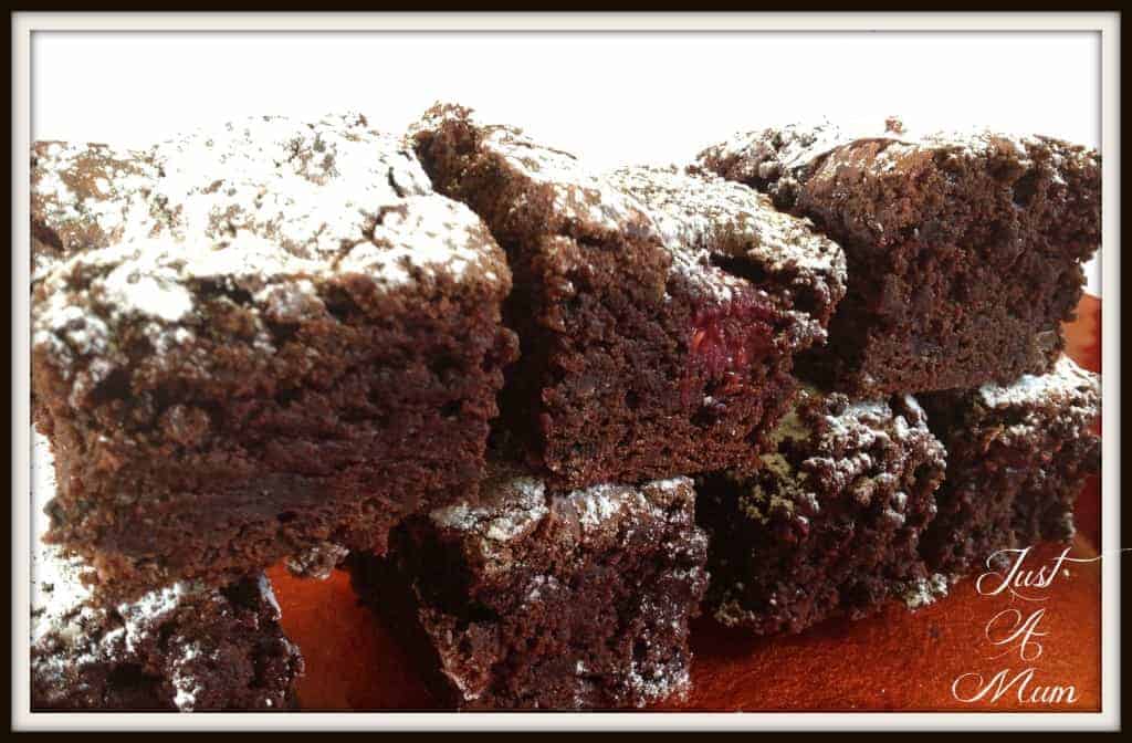 A stack of chocolate brownie on a red plate