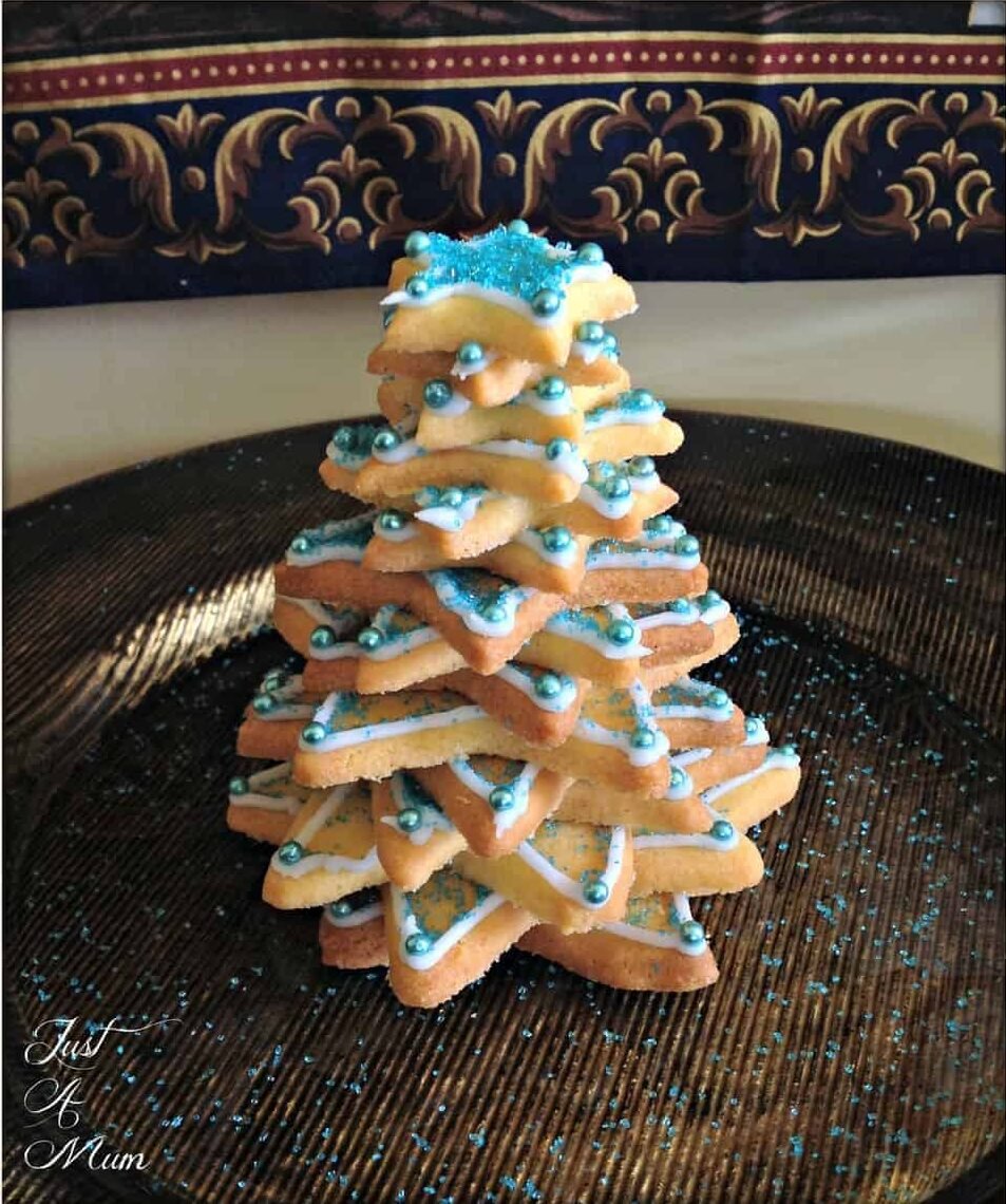 Cookie Christmas Tree set up on plate dusted with blue glitter