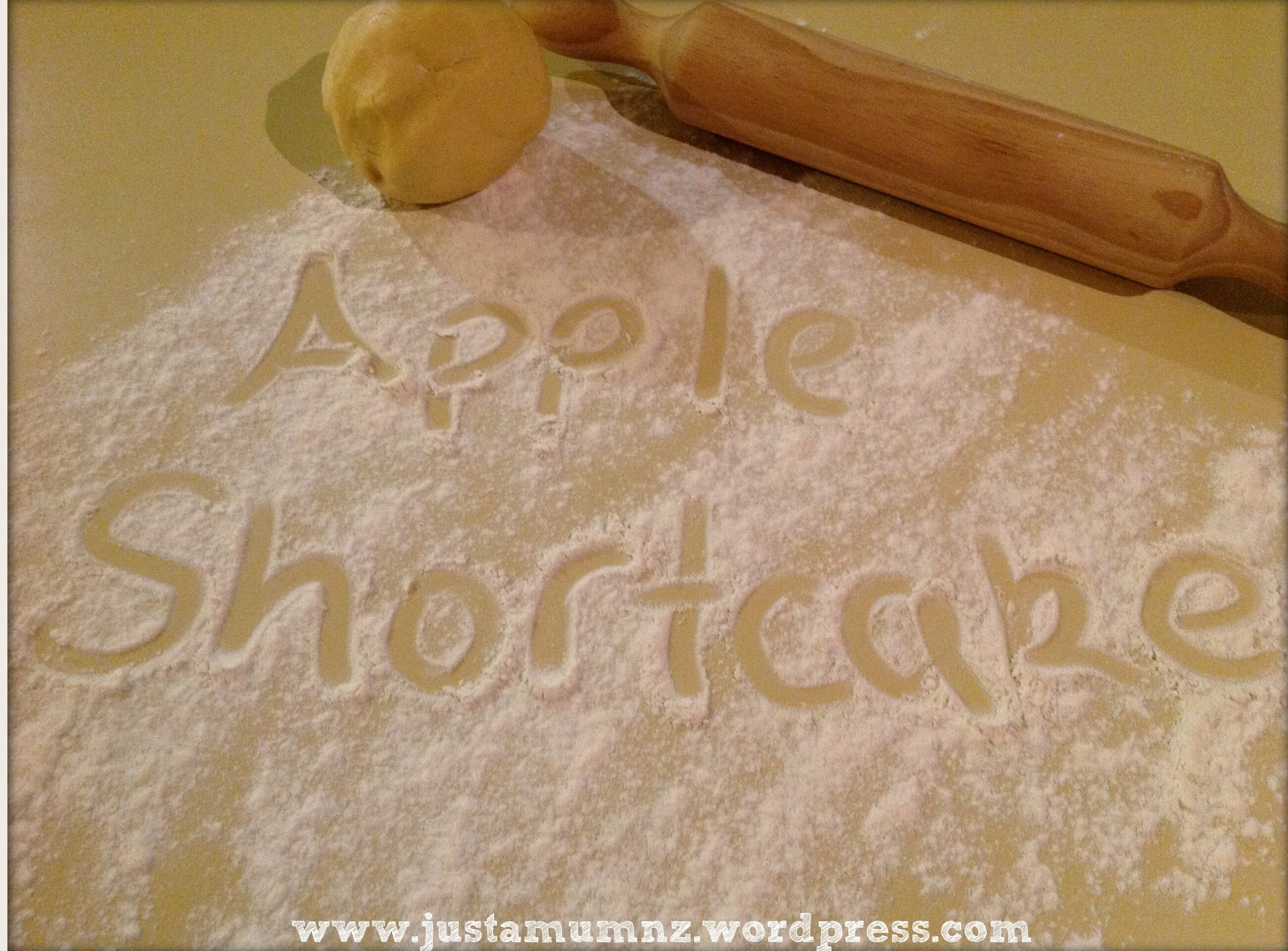 Words Apple Shortcake written in flour on the bench