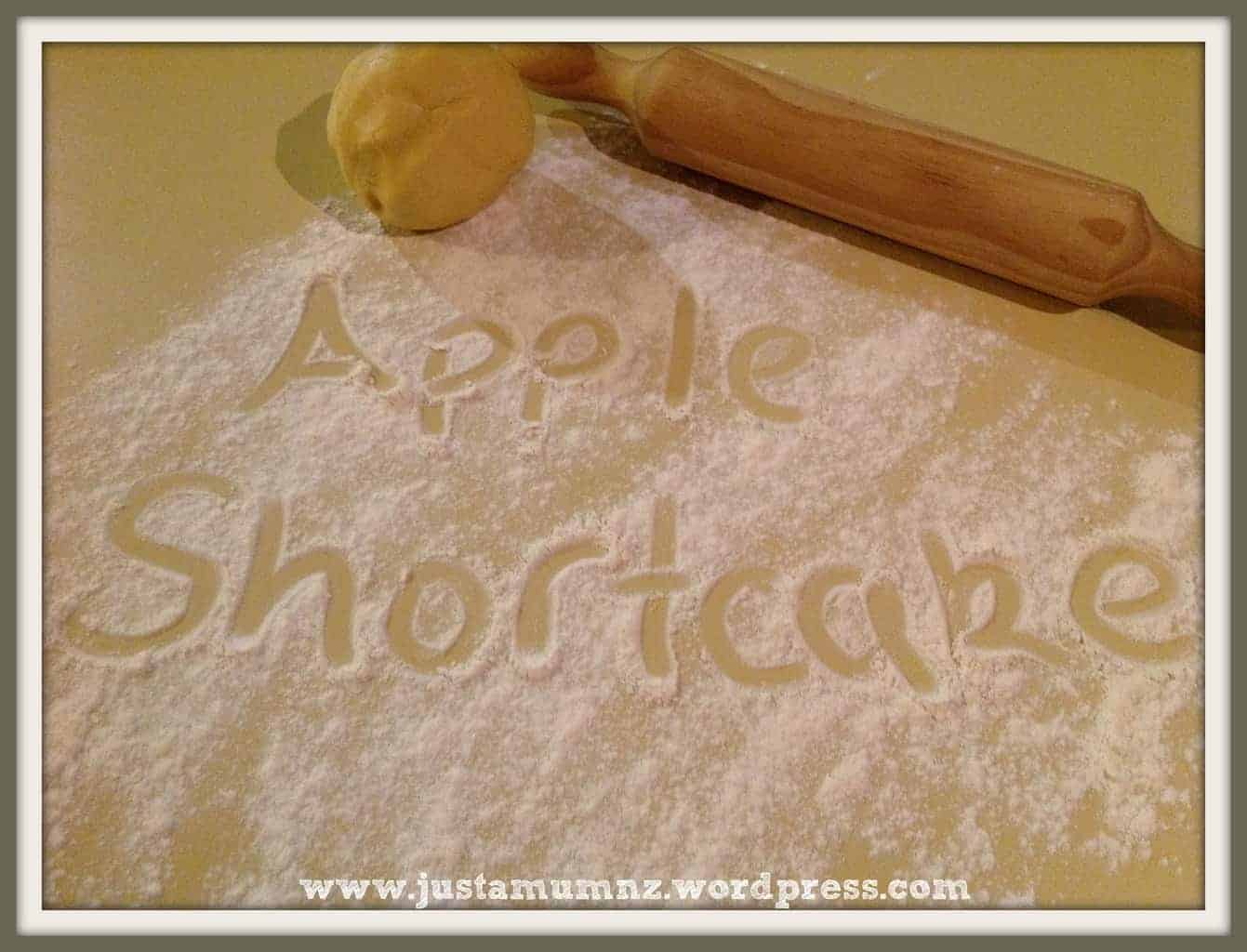 Words Apple Shortcake written in flour on the bench