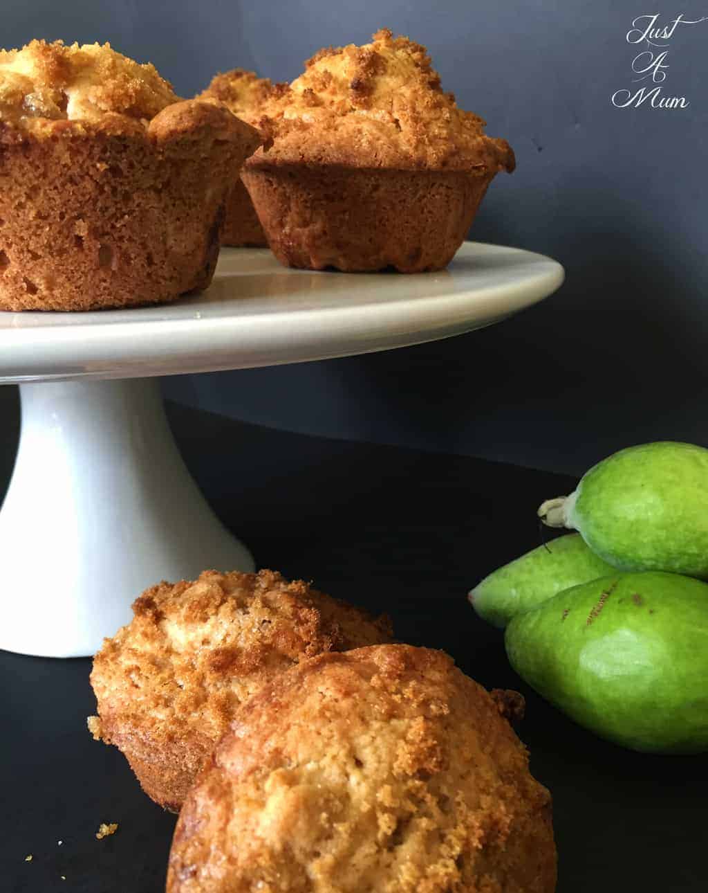Feijoa Crunch Muffins on a white cake stand