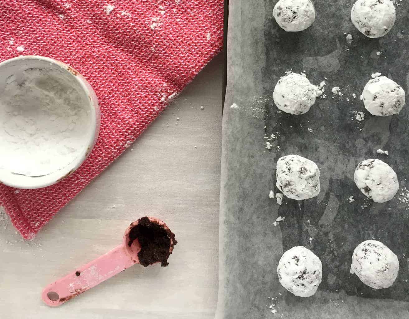 chocolate crackle biscuit dough rolled in icing sugar