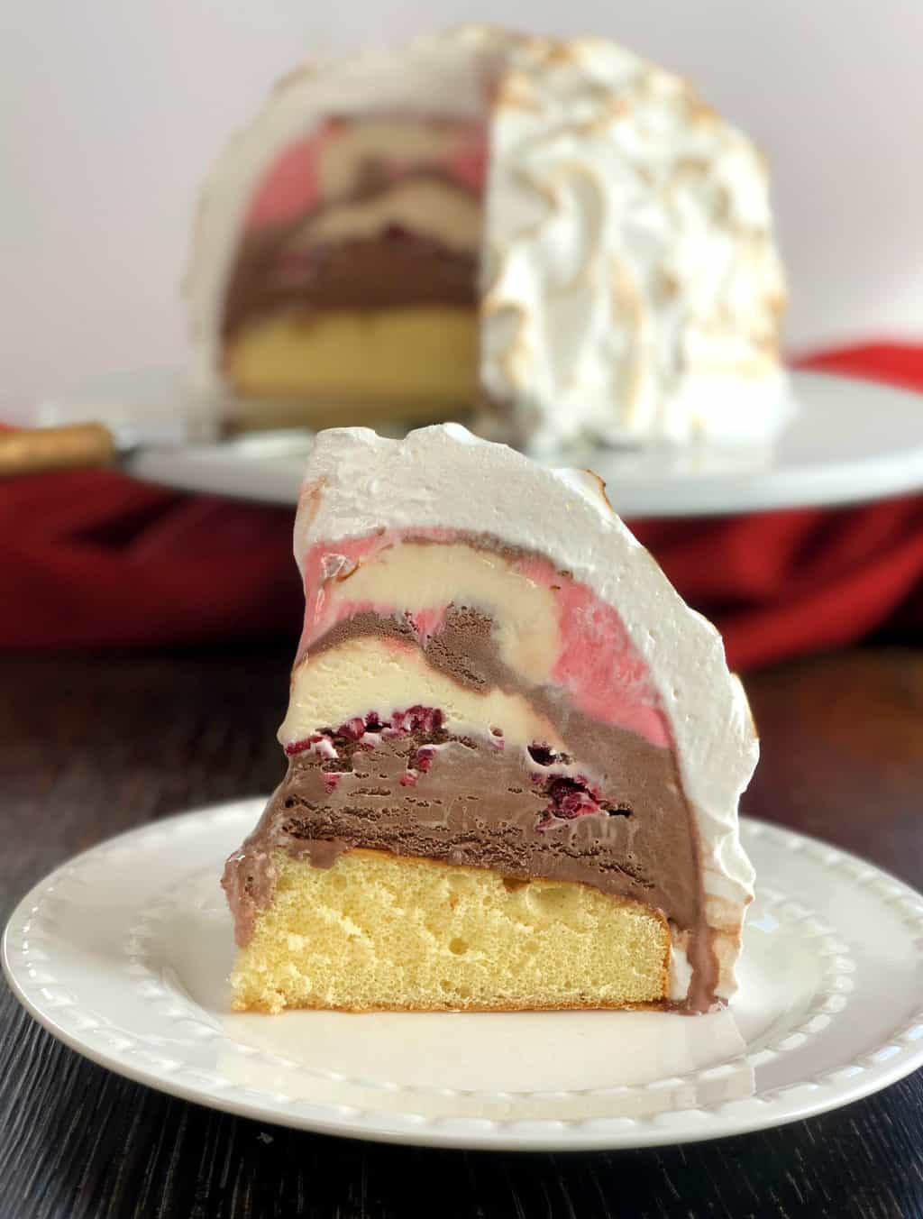 A slice of Just A Mums Easy Baked Alaska showing layers