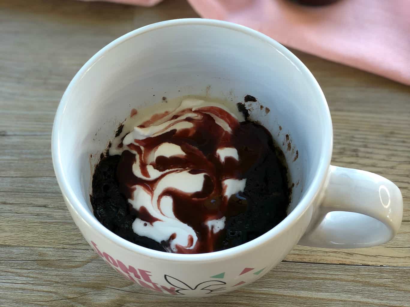 Self Saucing Mug Cake with Cacao Nib and Raspberry Couli over a whipped coconut cream