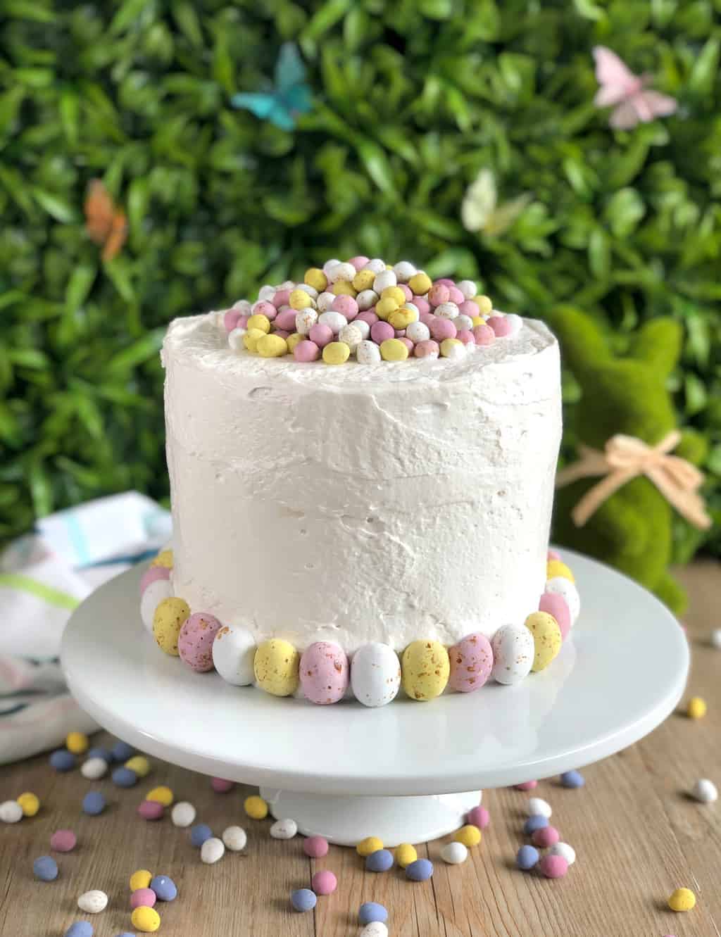 Easter Cake with festive easter eggs and honey meringue frosting