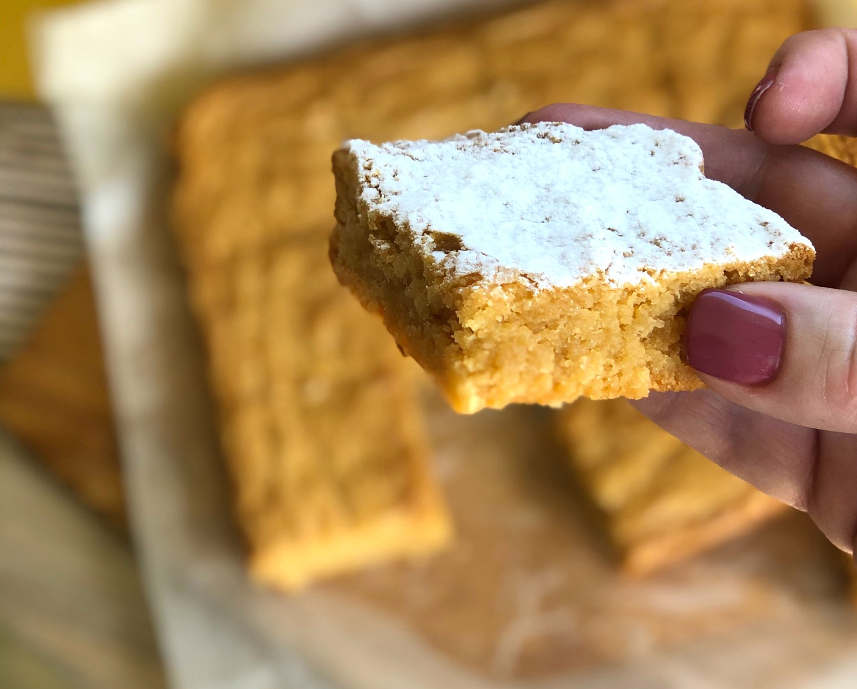 Holding a piece of Caramilk Blondie 