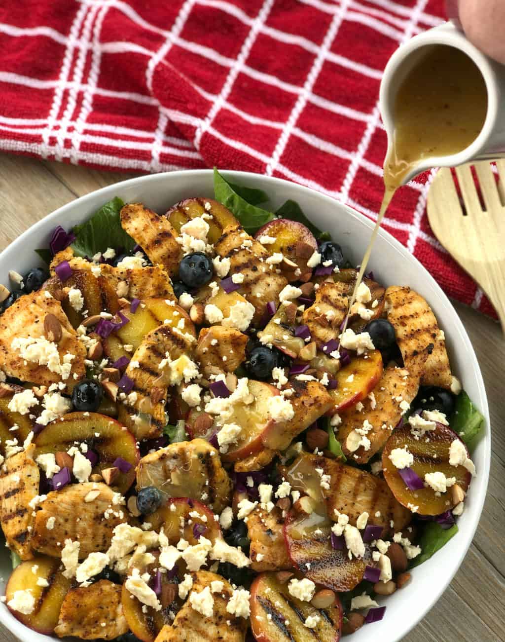 Pouring Honey Mustard Dressing over Chicken Salad 