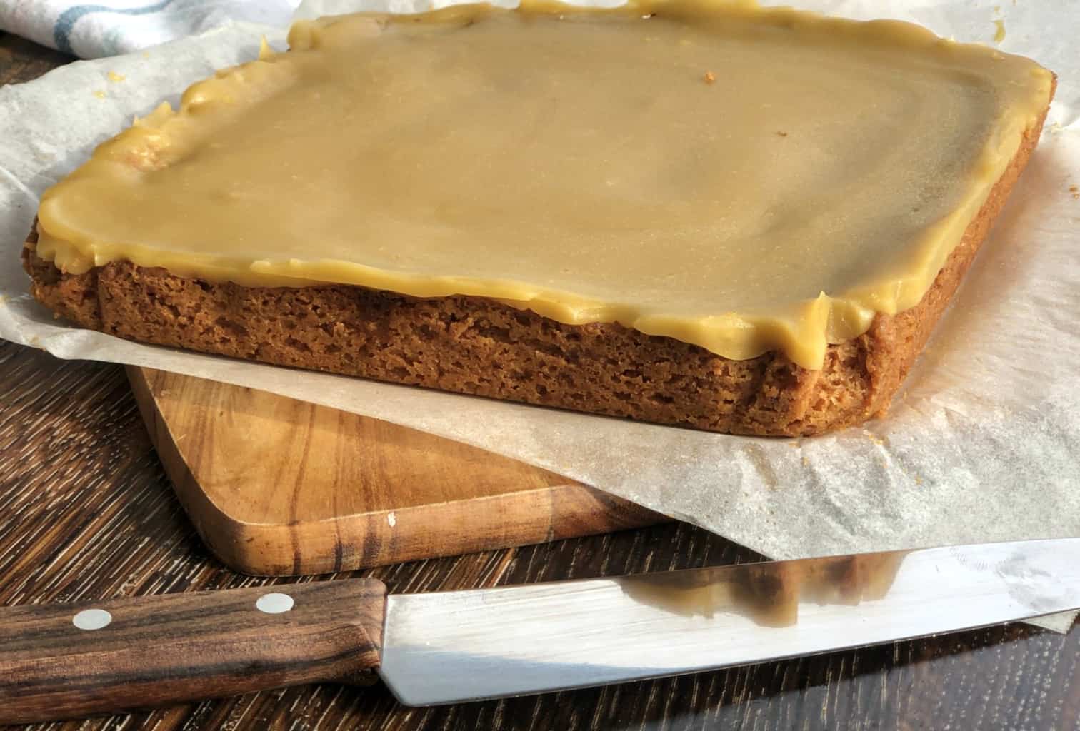 Side profile of the walnut slice with thick icing