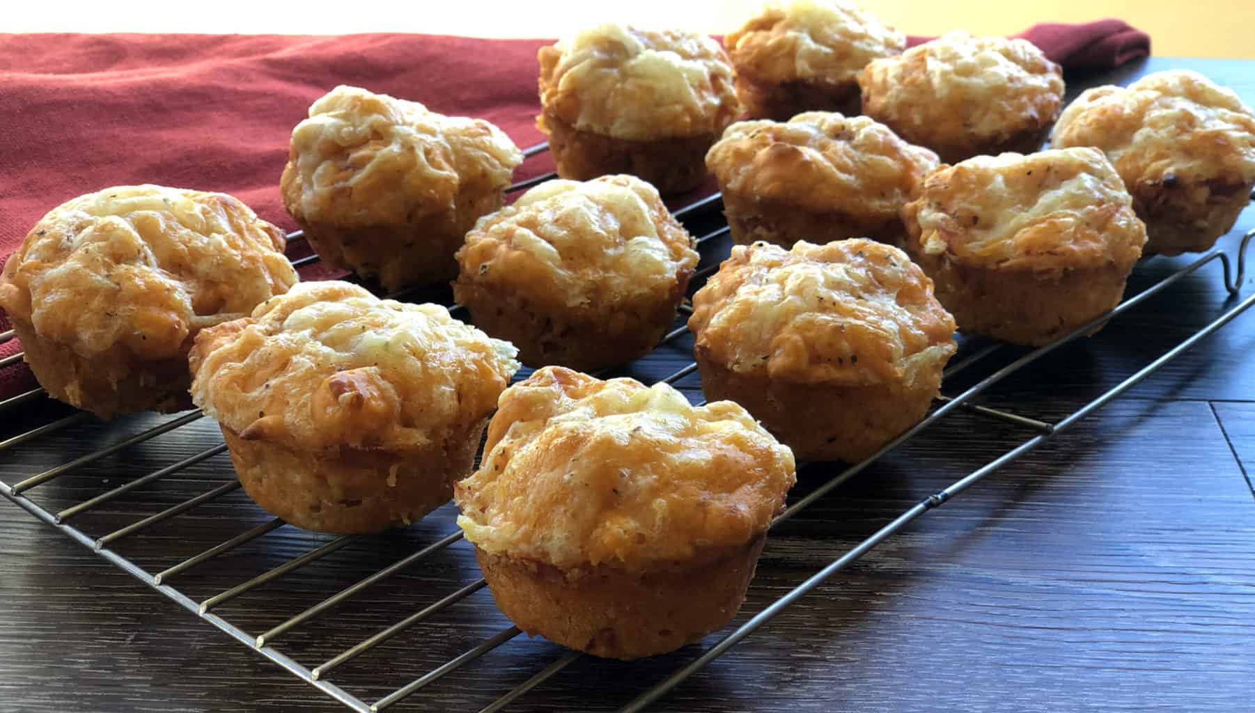 Fresh Savoury Muffins Cooling on a Wire Rack 