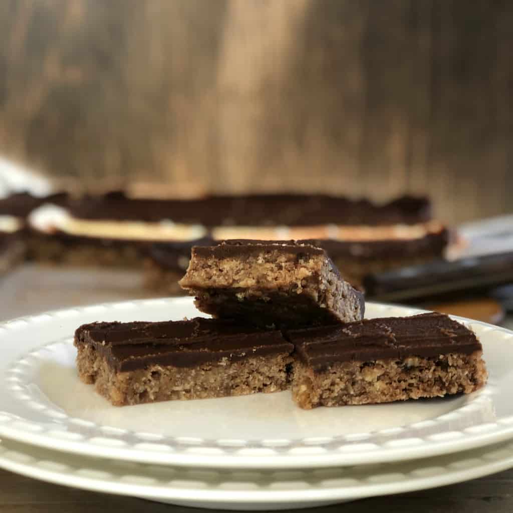 Three pieces of chocolate chew slice on a white plate