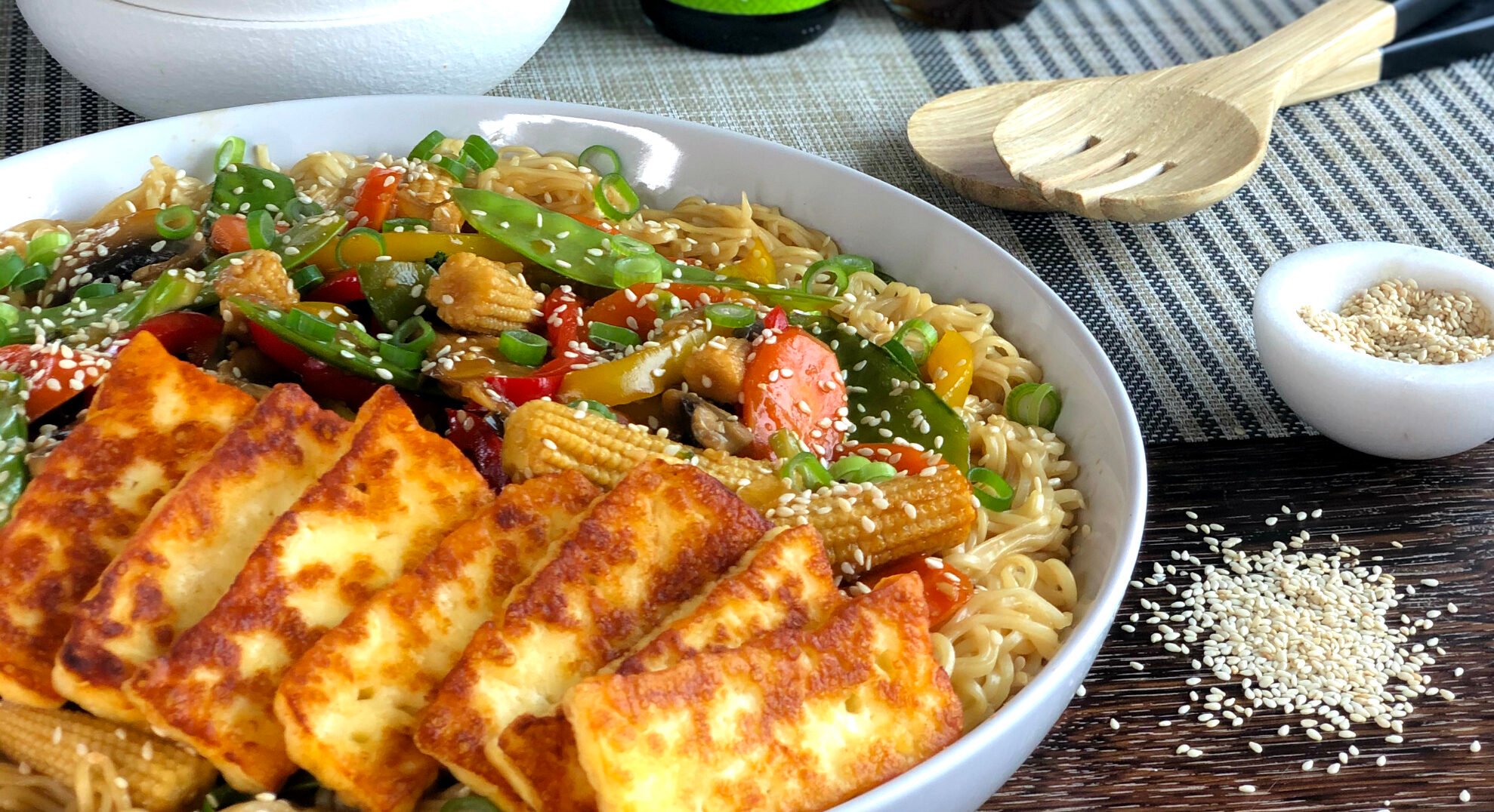 Bowl of Stir fried vegetables with pan friend halloumi 