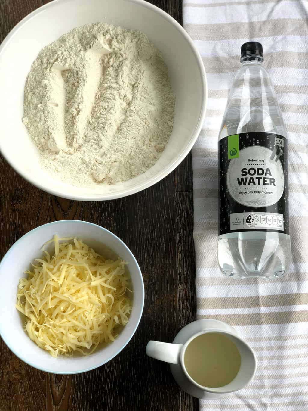 Overhead photo of ingredients used in cheese scones, see recipe card for details