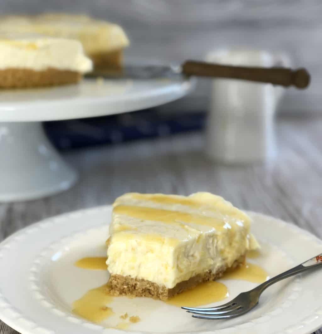 Delicious slice of pineapple cheesecake with a bite taken out