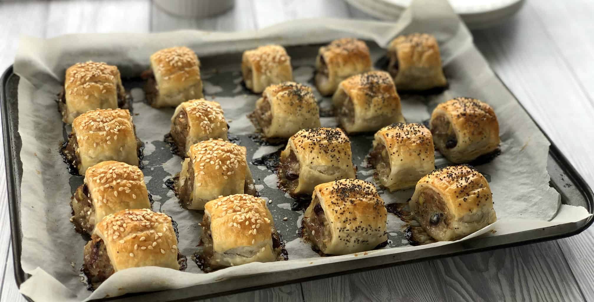 Ovenbaked sausage rolls with pork, cranberry and apple