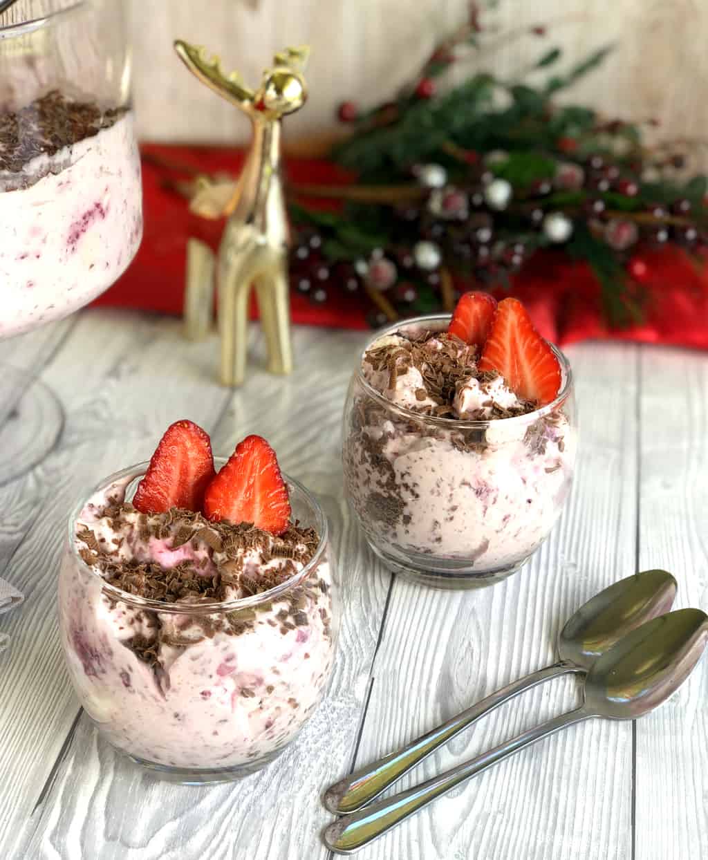 Two glasses of summer dessert with whipped cream