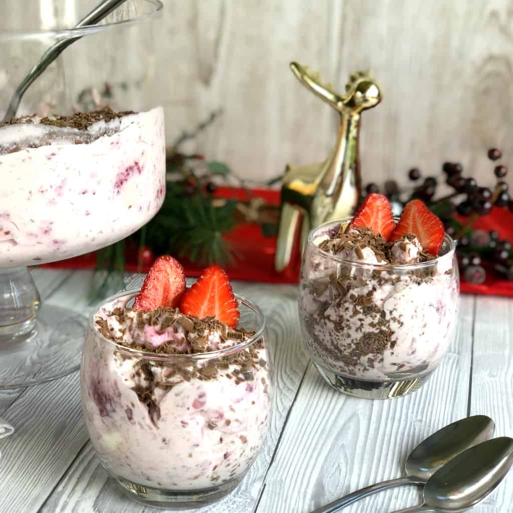 Two glasses filled with Ambrosia strawberries and chocolate 