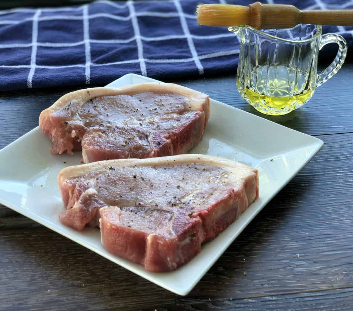 Season Pork Chops with olive oil and salt and pepper before pan frying 