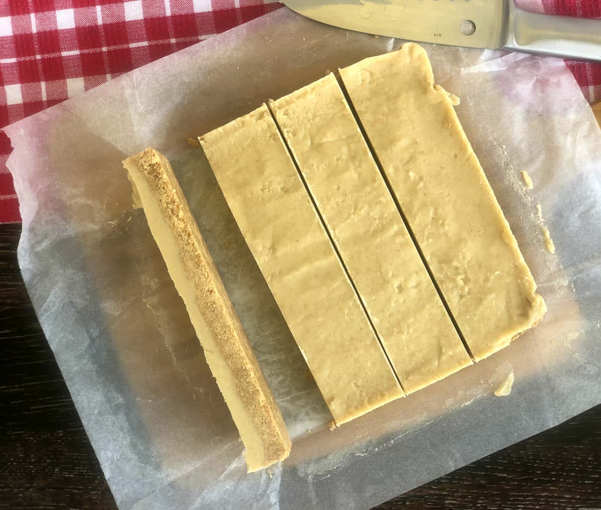 overhead photograph of a no bake ginger slice, cut into 4 rectangles 