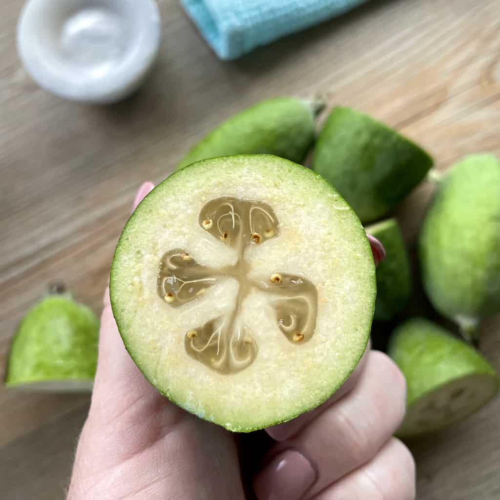 Feijoa, sliced in half to see the feijoa flesh