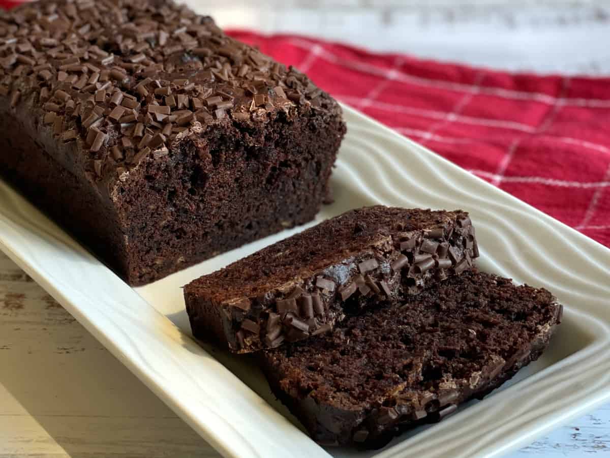 Banana Chocolate Loaf, sliced on a white plate 