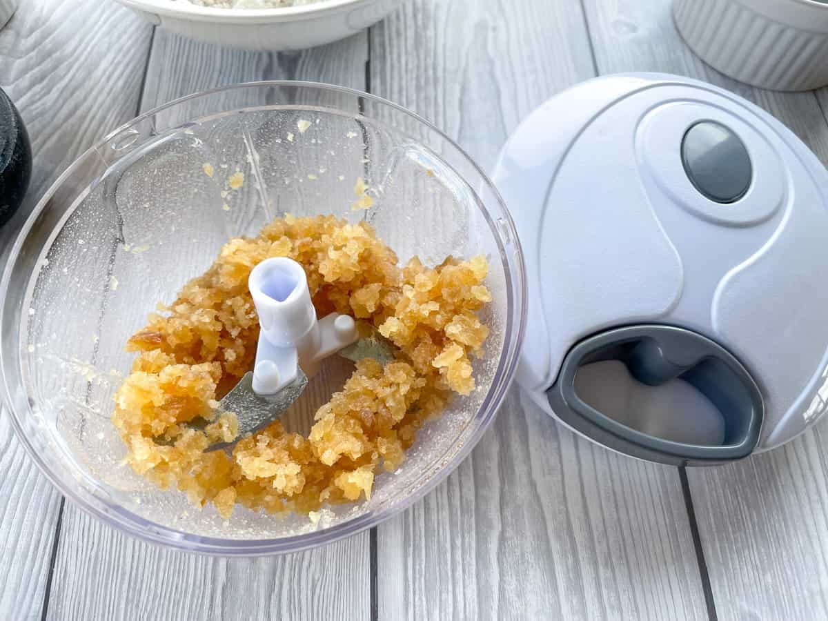 Finely diced crystallized ginger in a pull chopper or zyliss 