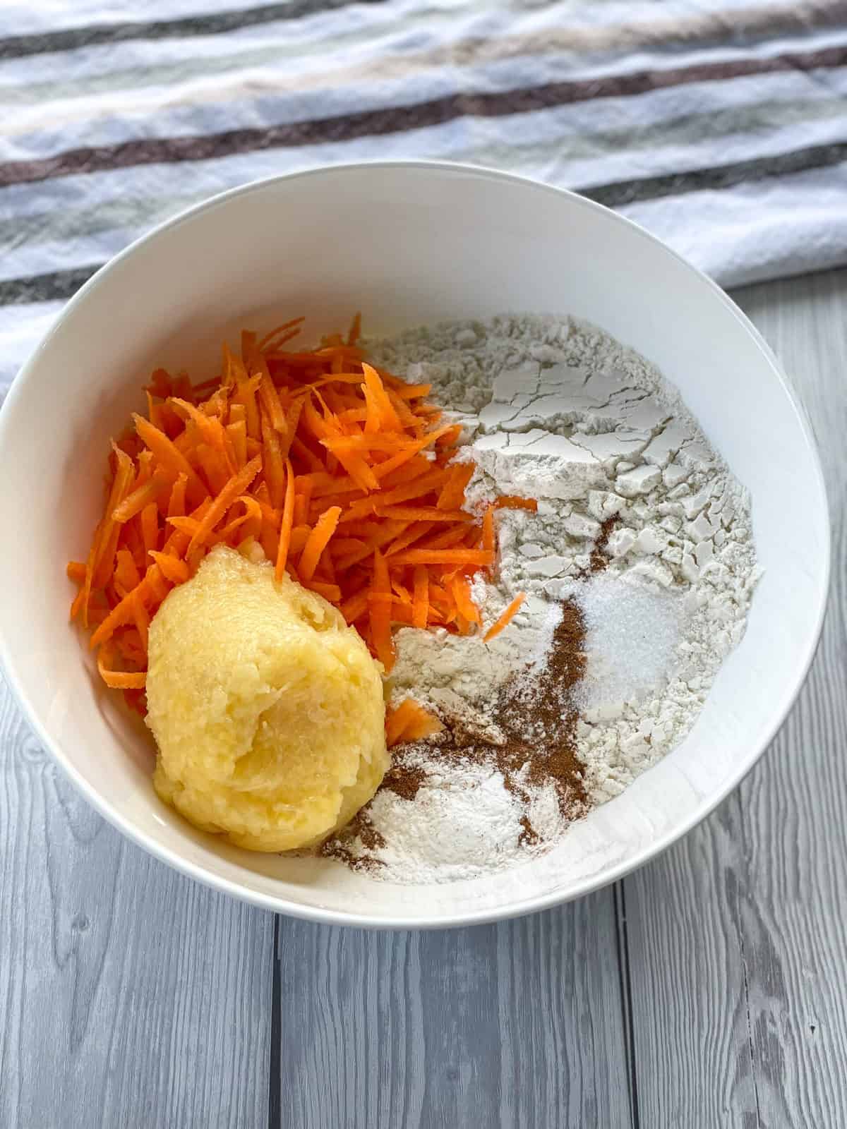 A white bowl with dry ingredients ready to be combined 