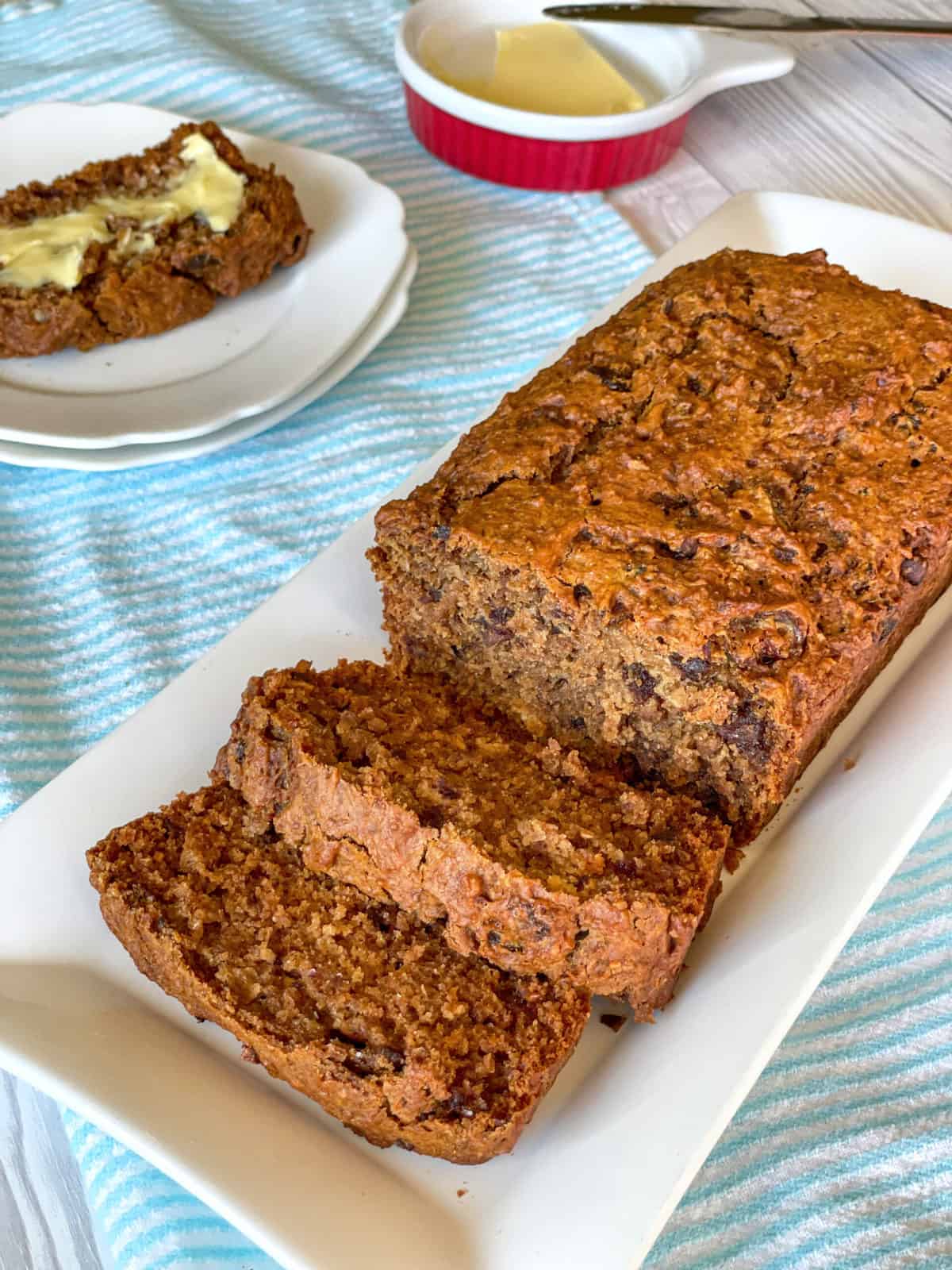 Weetbix and date loaf sliced on a white platter