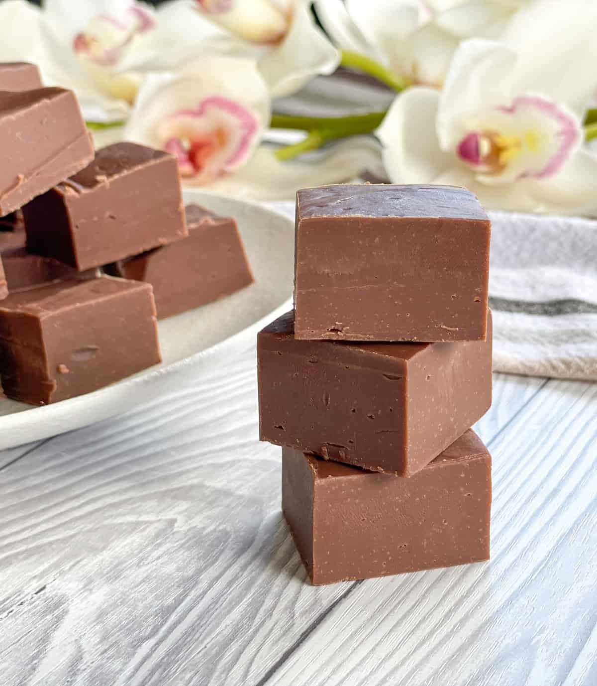 3 pieces of milk chocolate microwave fudge in a pile 