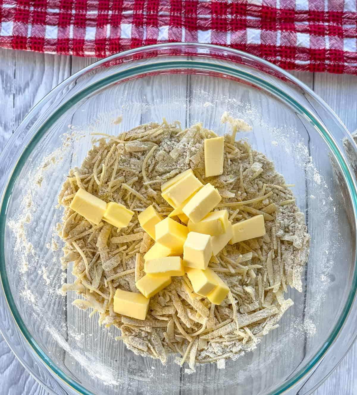 Rubbing the butter into the flour and cheese mixture to make crackers 