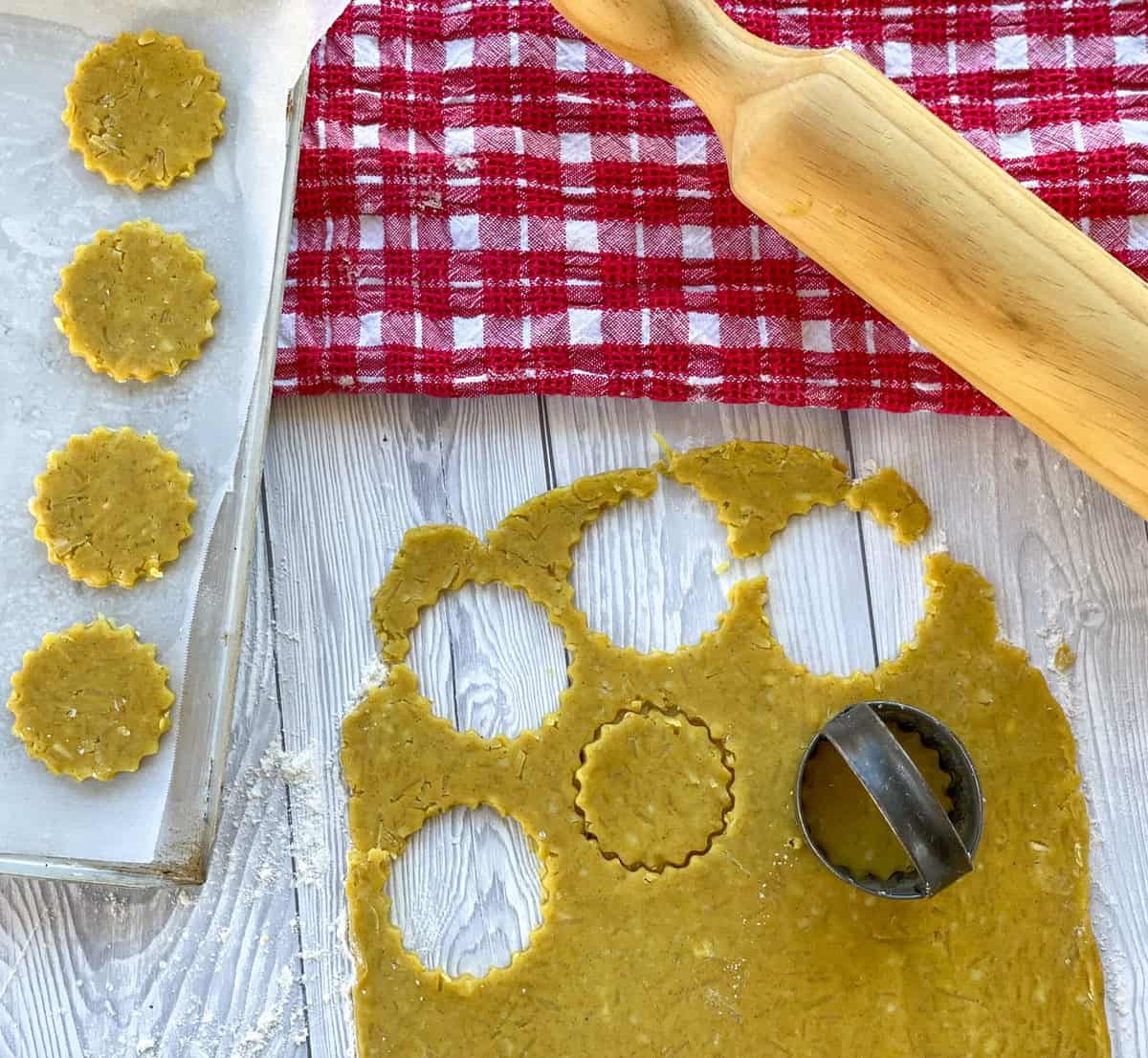 Shows making homemade crackers cutting from the rolled out dough