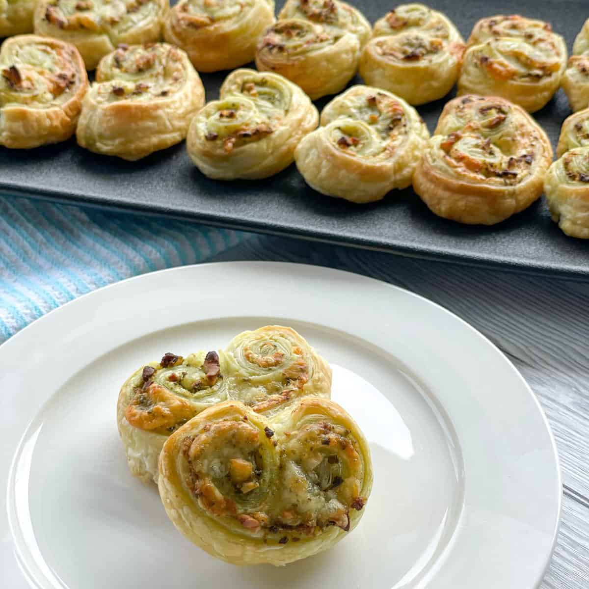 White side plate with pesto palmiers 