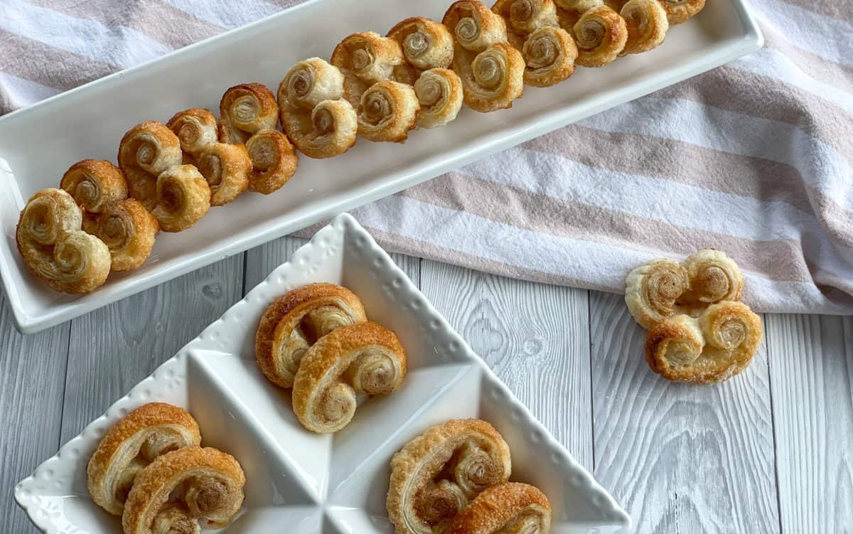 White platters serving sweet sugar palmiers 