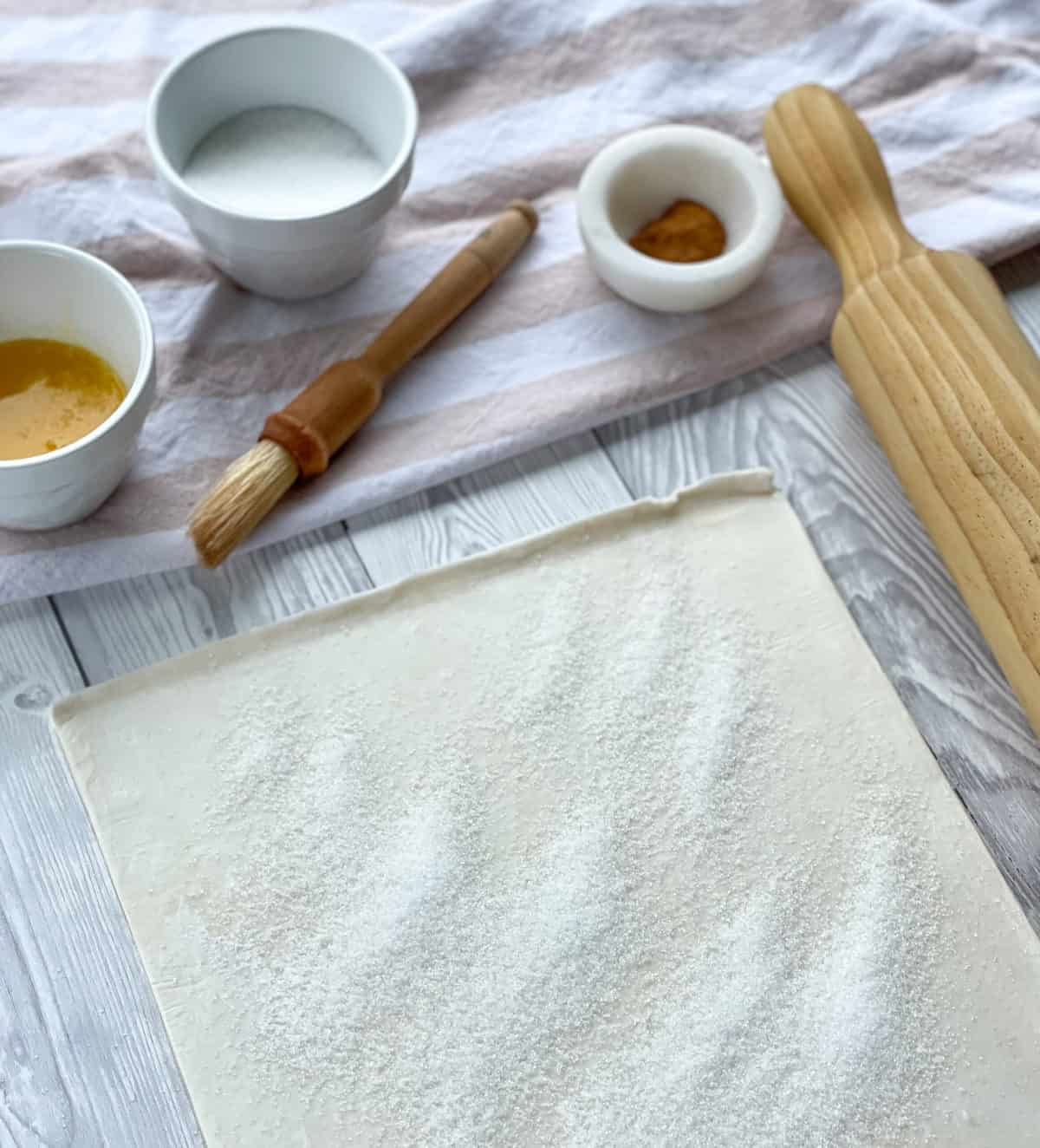 Coat one side of the pastry with sugar before turning over to fill 