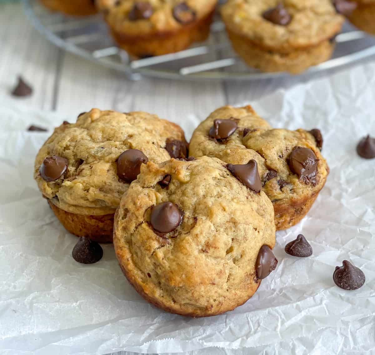 Banana Weetbix Muffins on a white background with chocolate drops 