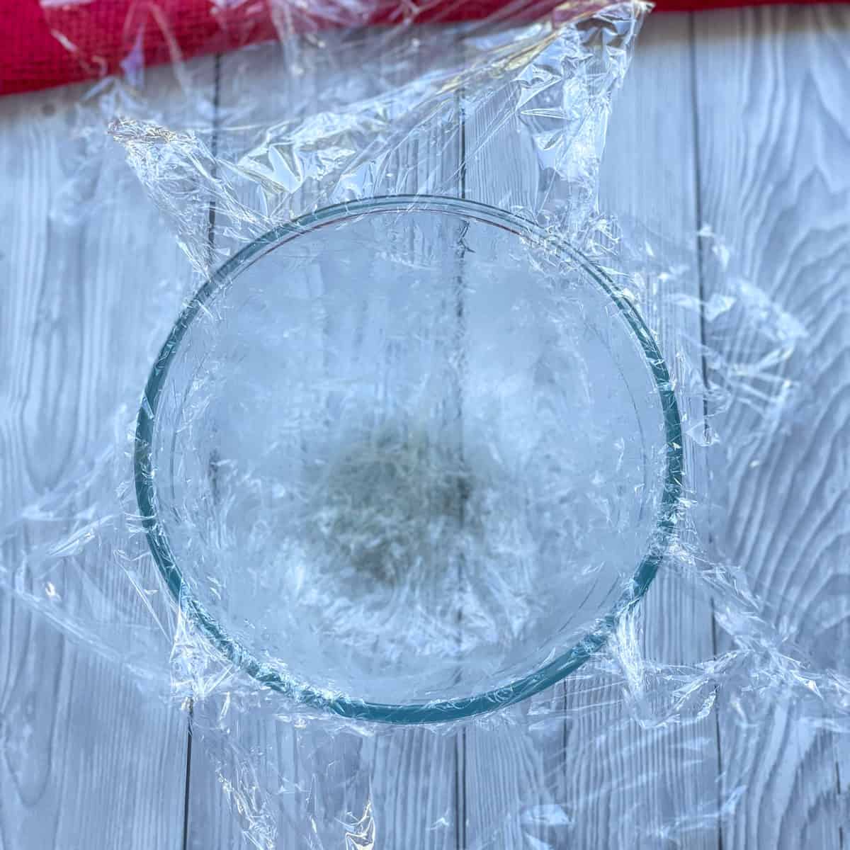 How to prepare the bowl for Summer Berry Filling with cling film 