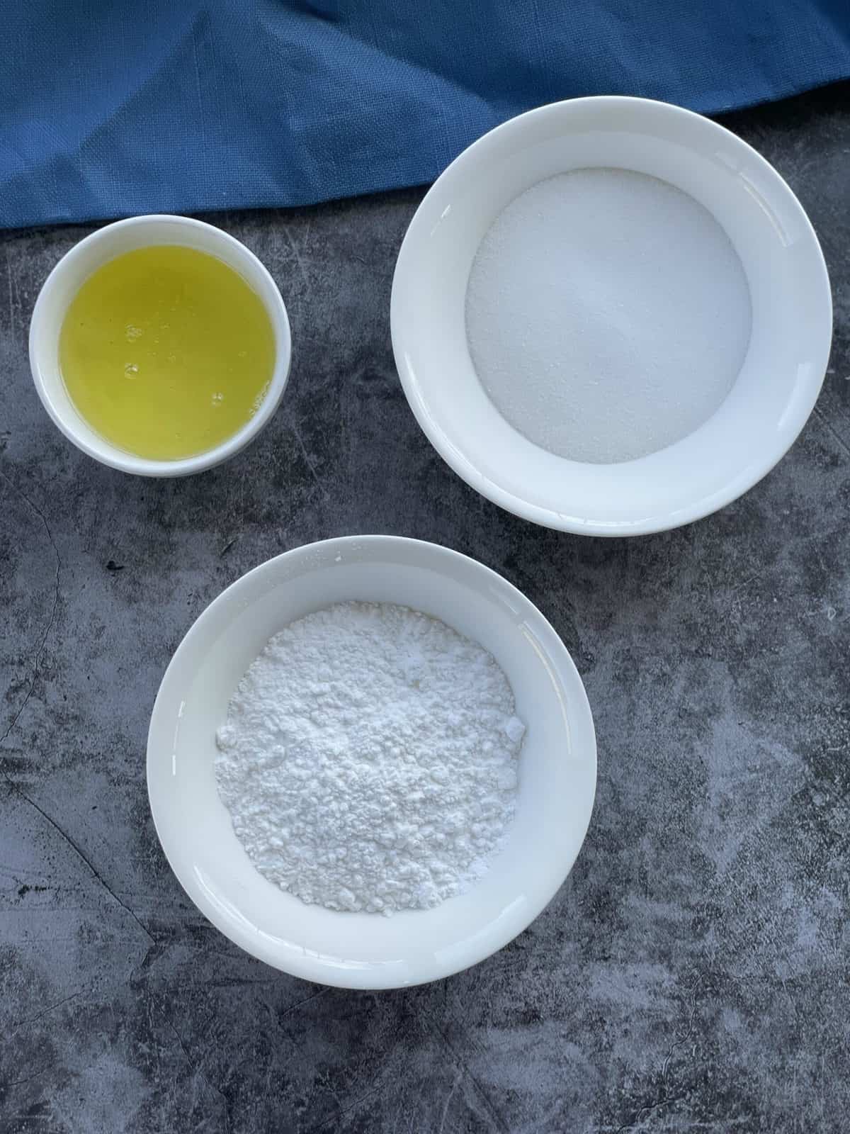 Ingredients for making meringues, egg whites, caster sugar, powdered sugar 