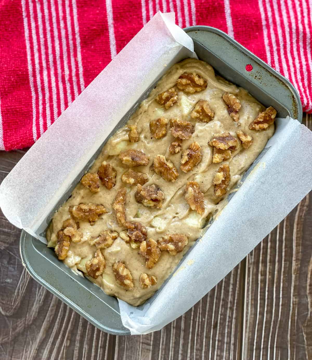 Batter for Apple and Walnut Loaf in a rectangle cake tin