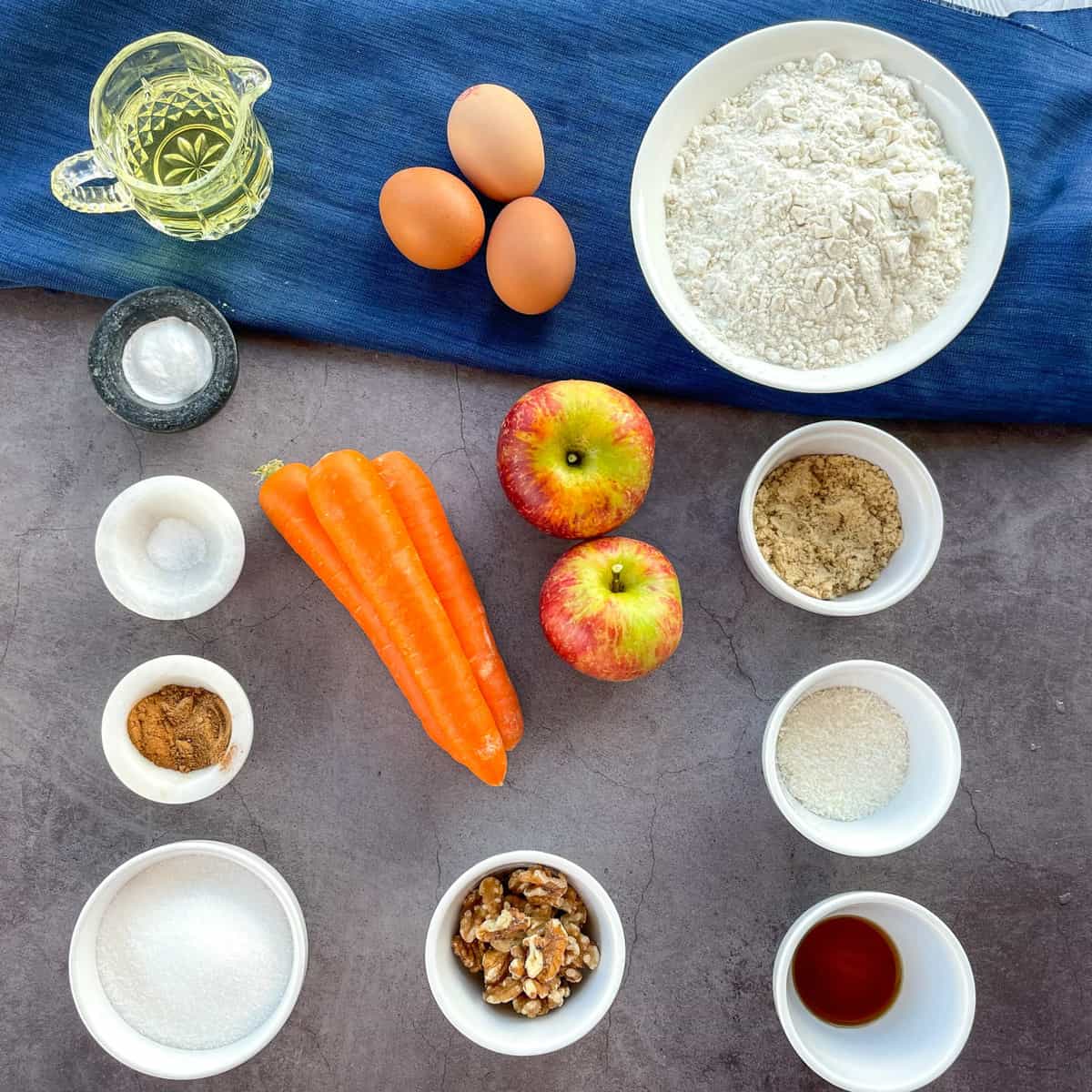Flatlay image of the ingredients used in apple and carrot muffins 