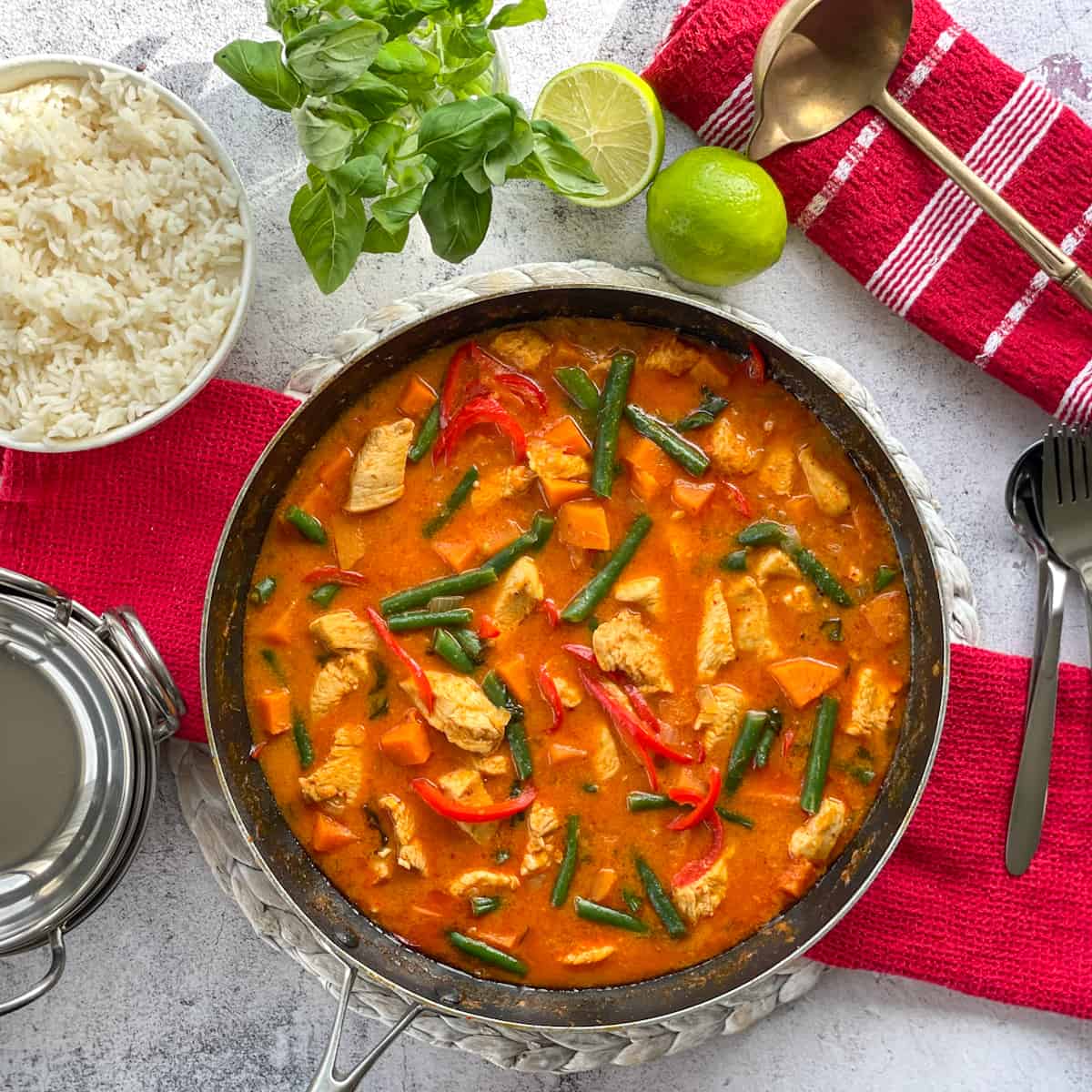 Pan full of chicken kumara red curry, filled with vegetables