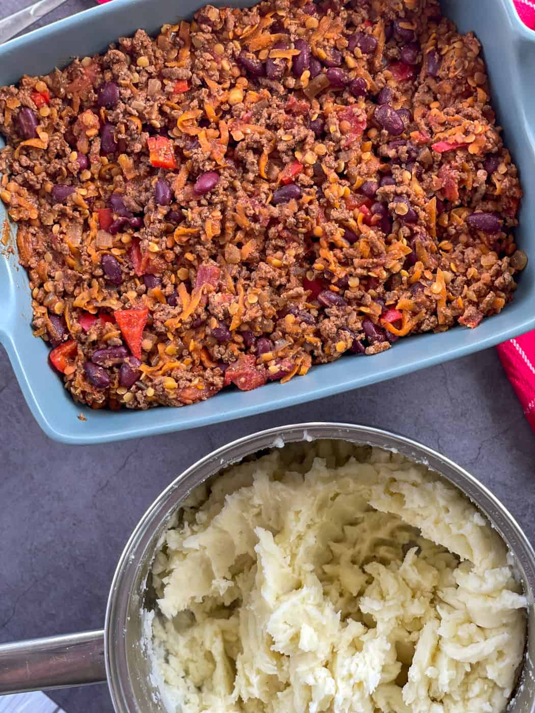 Chilli Con Carne with a pot of mashed potato