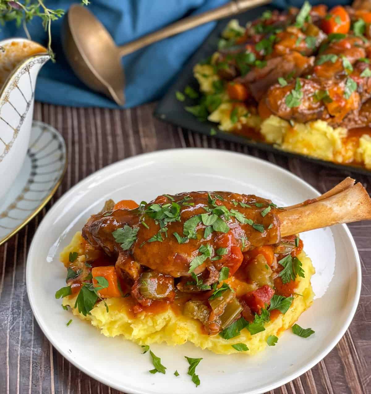 Lamb Shanks with vegetables served over mashed potato