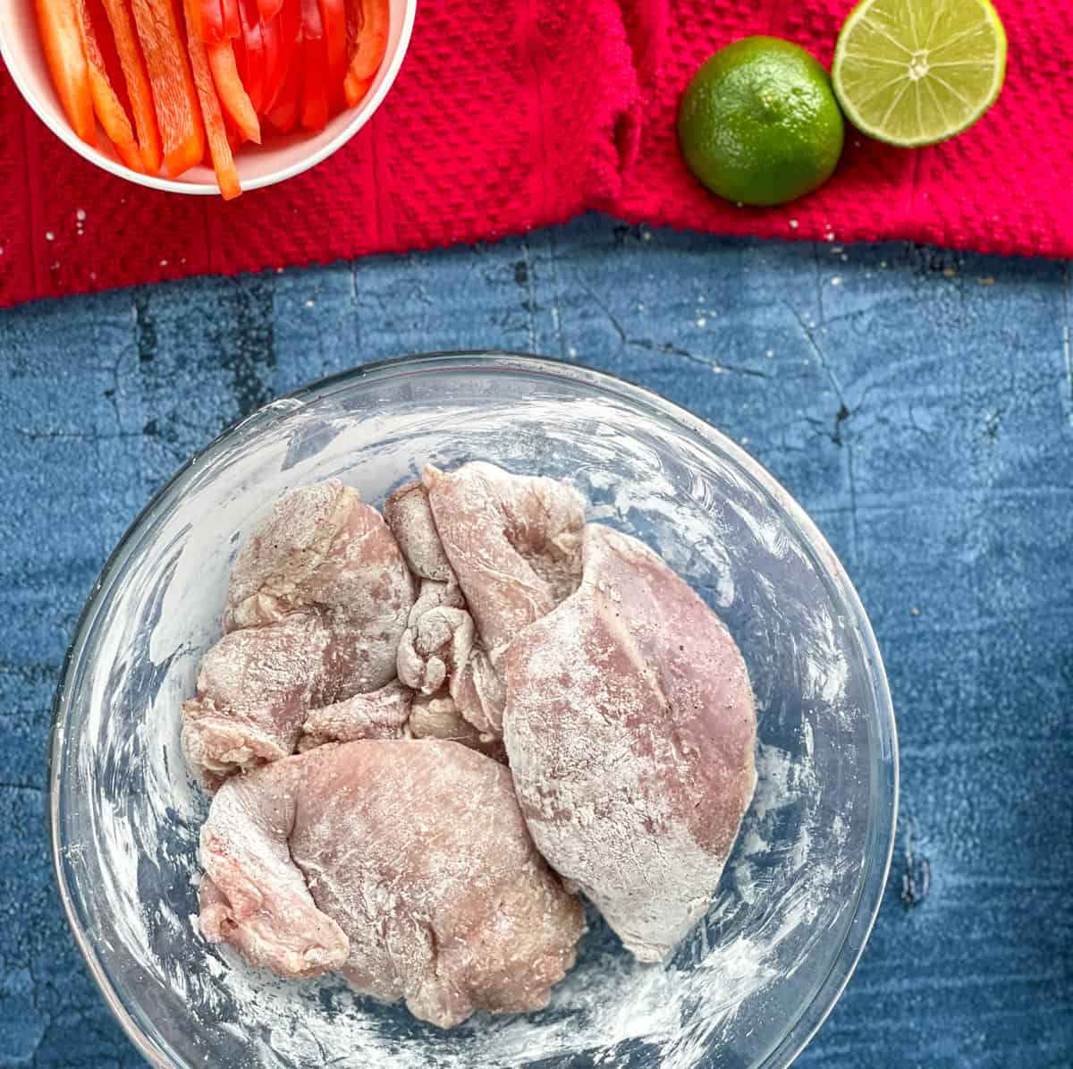 How to coat chicken thighs in cornflour, seasoned