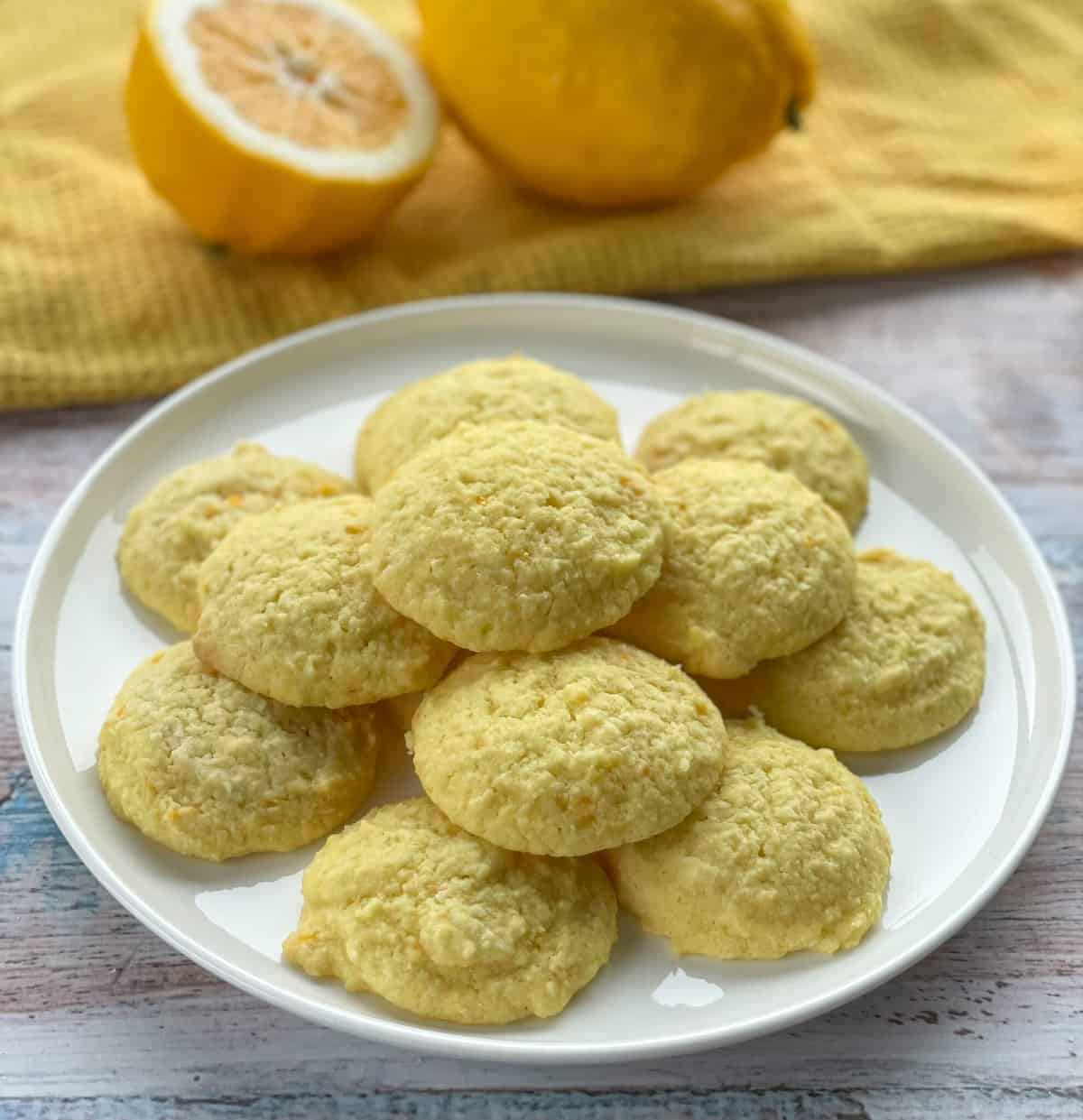 A white plate of lemon and coconut soft cookies 