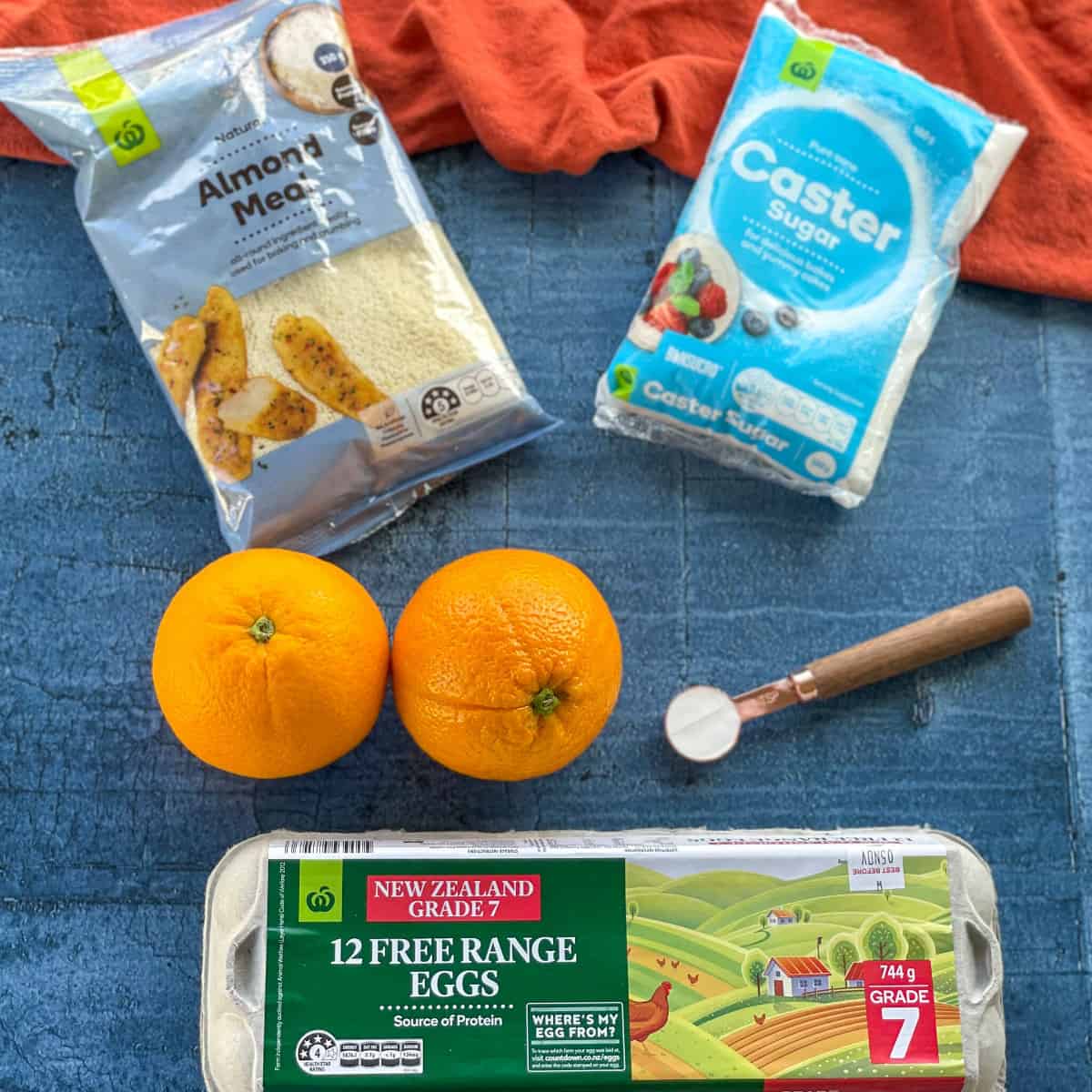 The ingredients required to make an orange and almond cake, see the recipe card 