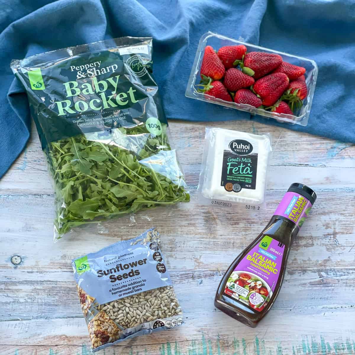 The five ingredients used for a rocket, strawberry and feta salad 