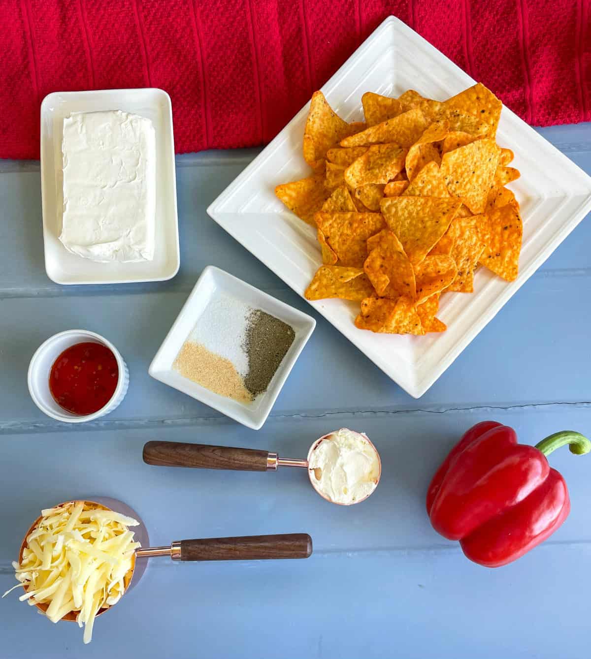 Ingredients needed to make a sweet chilli cheeseball with a corn chip dorito crumb