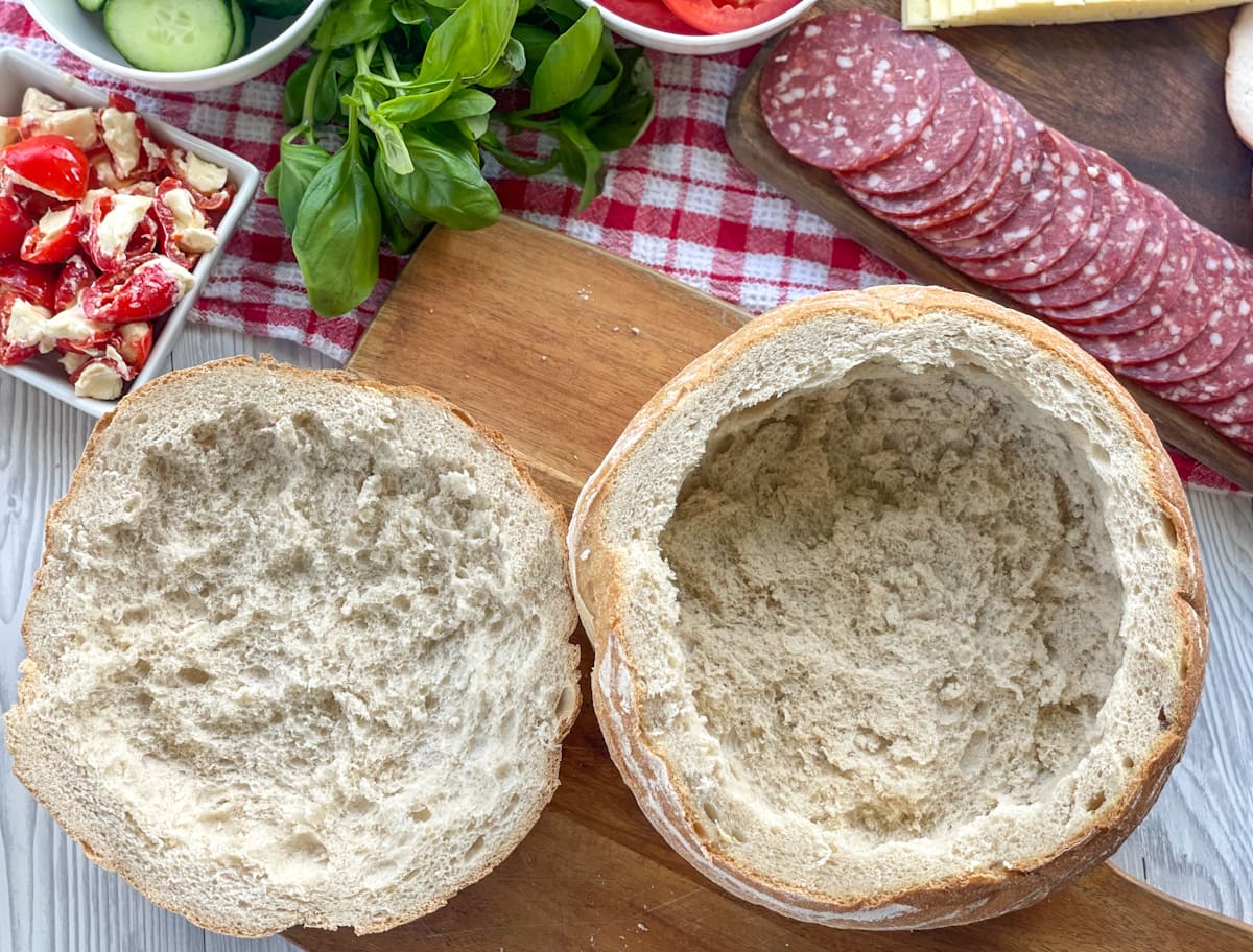 How to scoop out the bread from a cob loaf for a stuffed layered sandwich